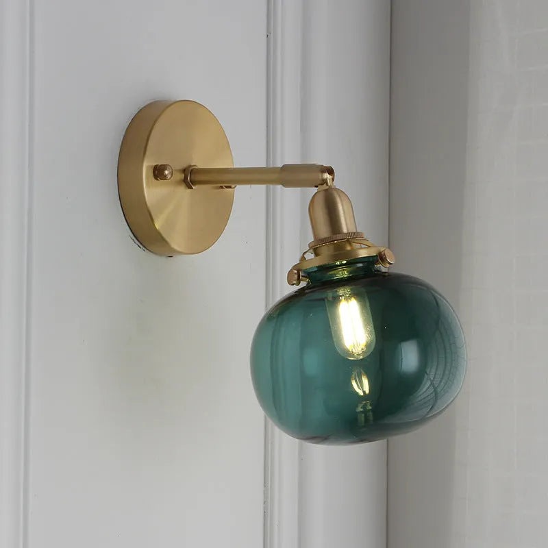 Pumpkin-shaped glass wall lamp in blue and transparent colour options.