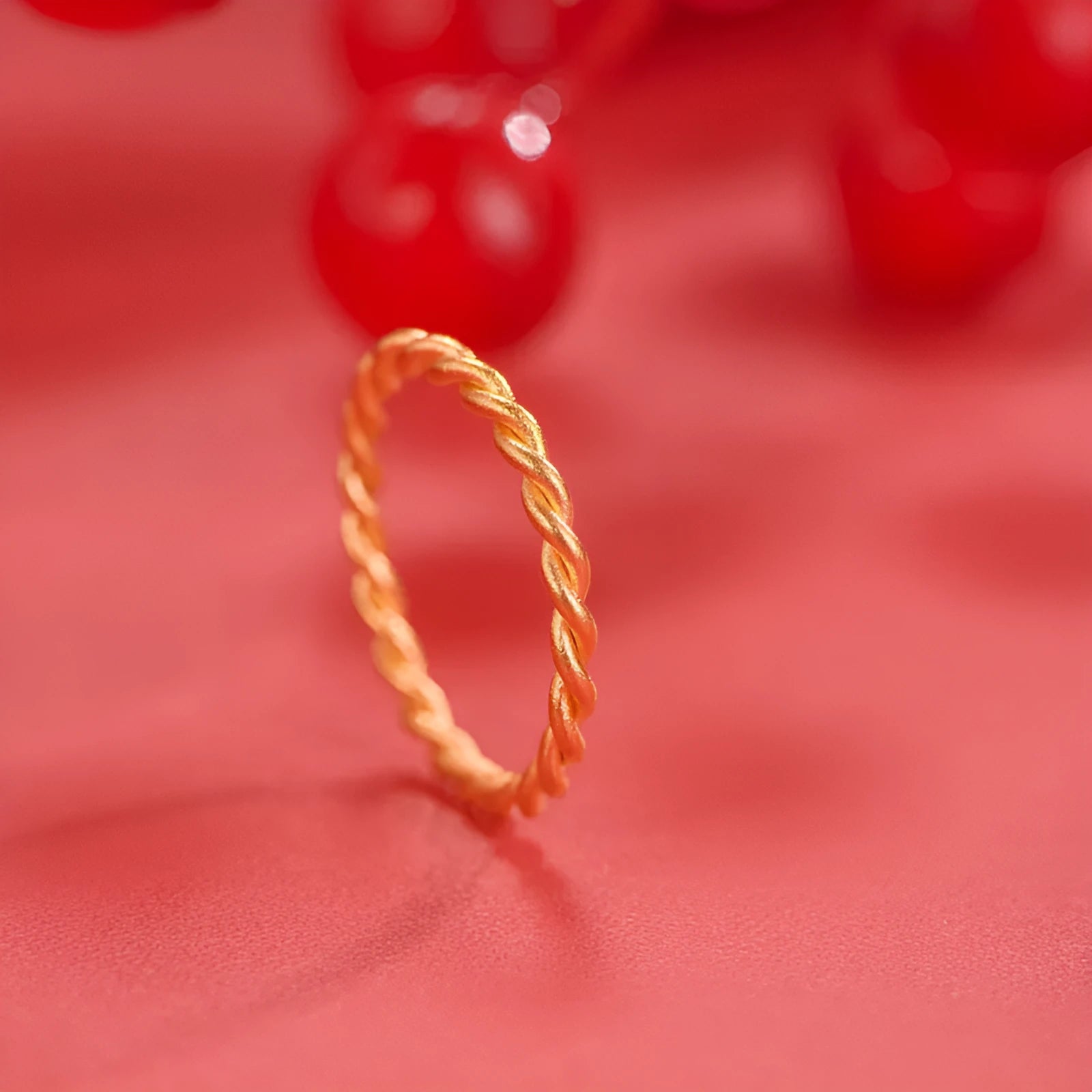 Women's simple bracelet style brass gold plated ring shown in twist, matte and glossy finish variations.