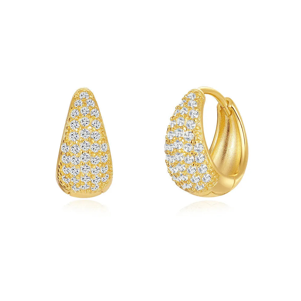 Geometric brass earclip earrings with a gold electroplated finish and round design details.