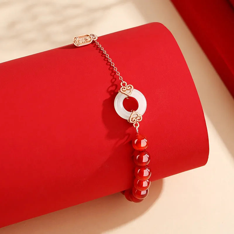 Sterling silver 925 bracelet with a peace buckle charm, xiangyun designs, and a fu character.