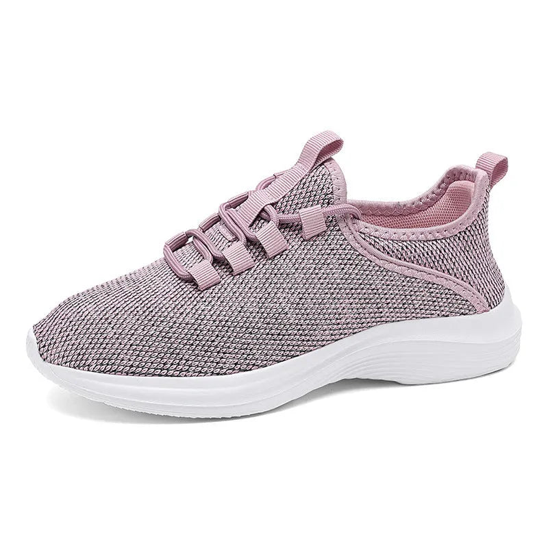 Women's low-top casual sneaker in grey with breathable mesh upper and lace-up front.
