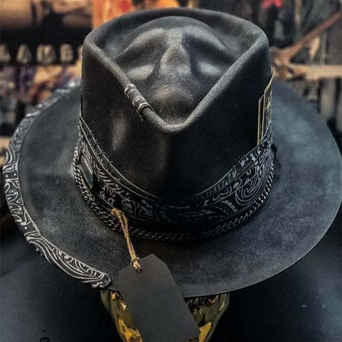 Handmade conical skull hat crafted from wool felt and denim fabric in a dark colour.