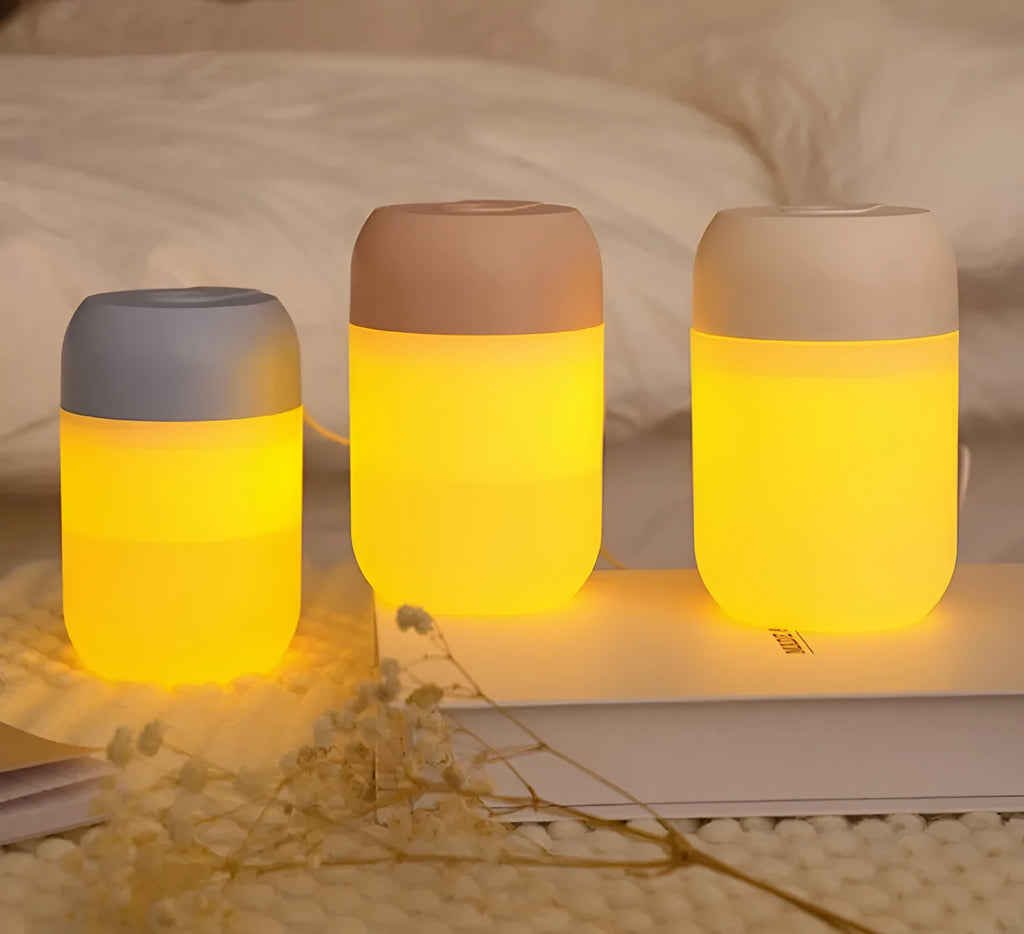 Small white cylindrical USB humidifier with aromatherapy function on desk