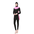 Women's black long sleeve hooded swimsuit top and pants set for swimming.