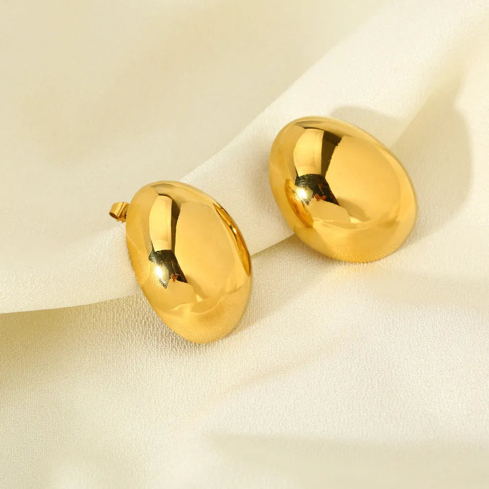 Geometric stainless steel ear studs with exaggerated glazed surface finish in DFE139 colour