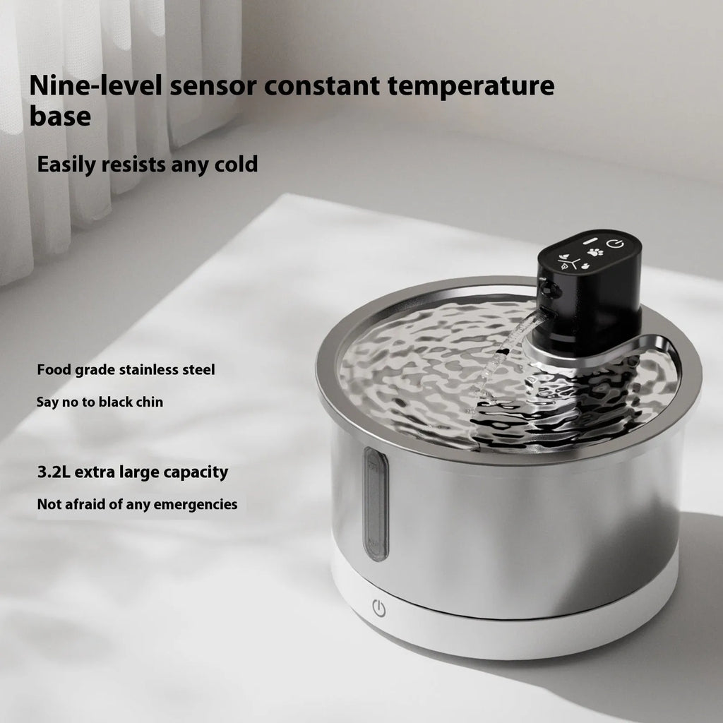 Stainless steel heated pet water fountain with white temperature control base for cats and dogs.