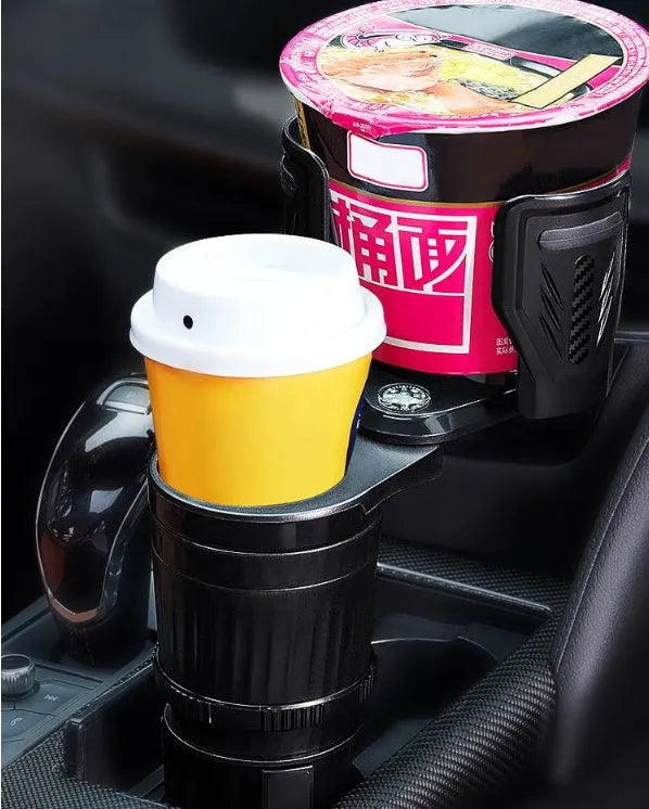 Black retractable car cup holder with adjustable base on a car dashboard.