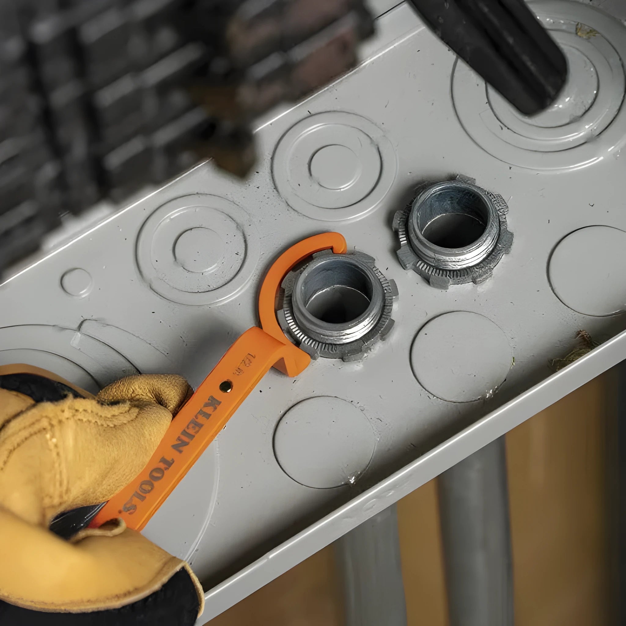 Crescent magnetic suction and catheter locking wrench three-piece set in orange, grey, and black.