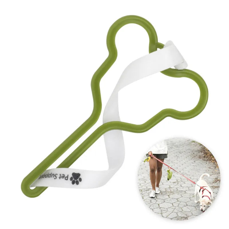 A hands-free dog poop bag holder with a fixed clip and adjustable black Velcro strap attached to a leash.