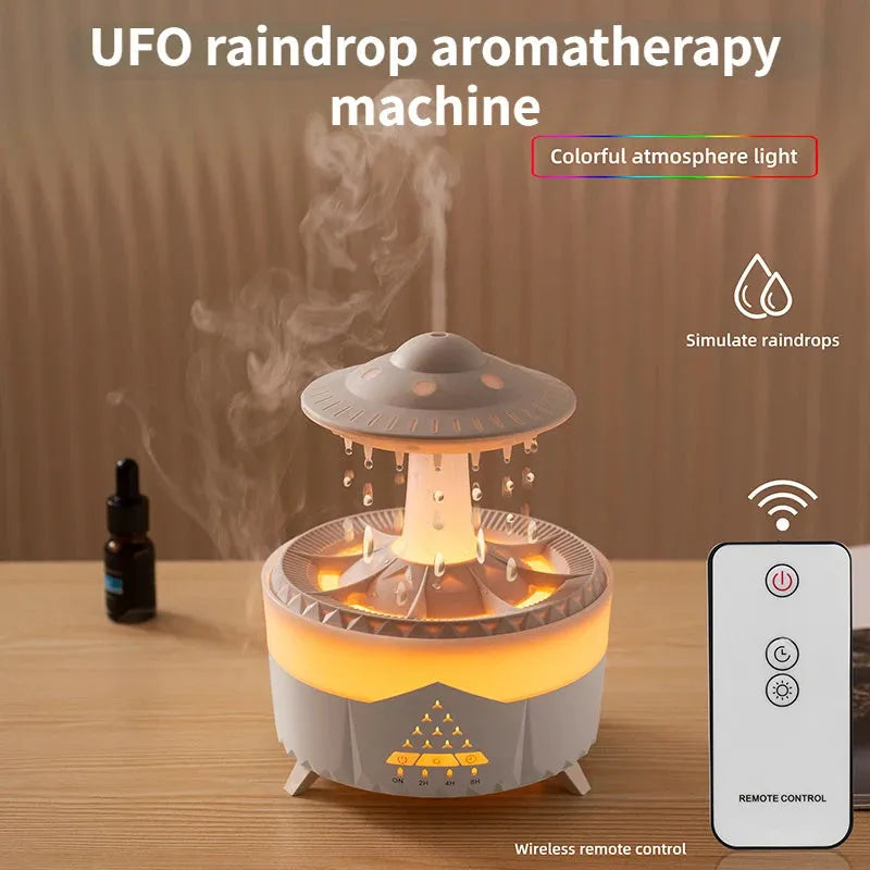 White cloud-shaped humidifier with raindrop mist and coloured night light on wooden table