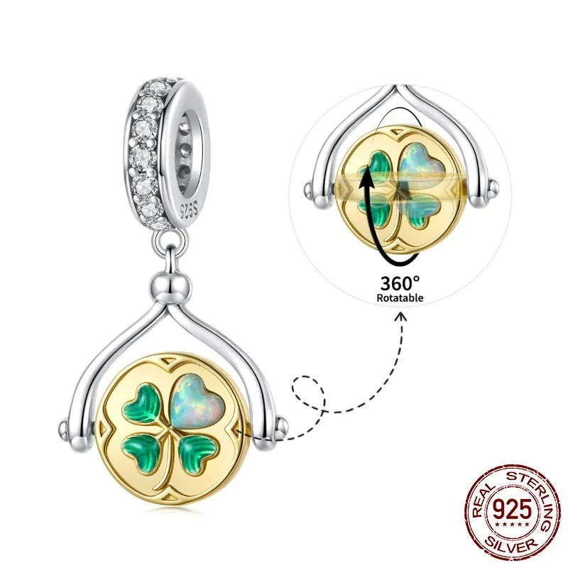 925 silver rotating card pendant with four-leaf clover pattern and wing element on white background