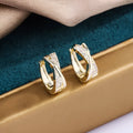 Geometric copper drop earrings with zircon stones in 14K yellow finish