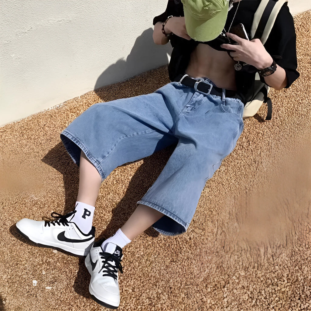 Blue men's thin denim pirate shorts with high waist and cropped straight legs on a neutral background.