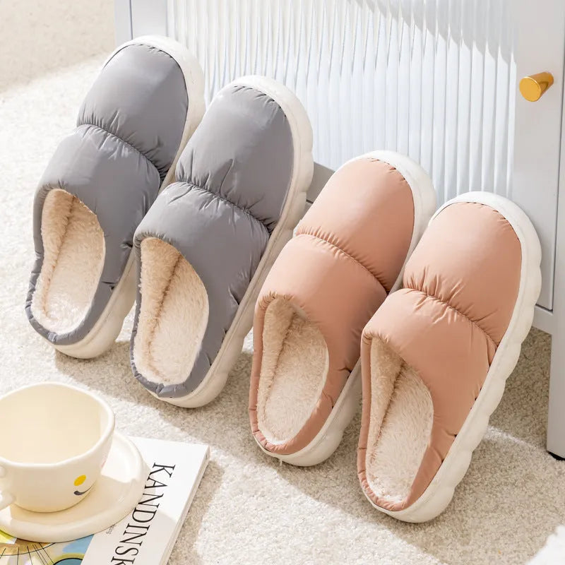 Down cotton house slippers with artificial leather upper, rubber sole, and plush lining in blue colour