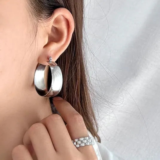 Curved widened stainless steel earrings with titanium steel in gold or steel colour, 25mm or 30mm sizes