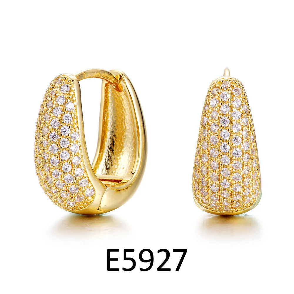 Brass gold plated heart shaped ear clip earrings with simple gang drill elements