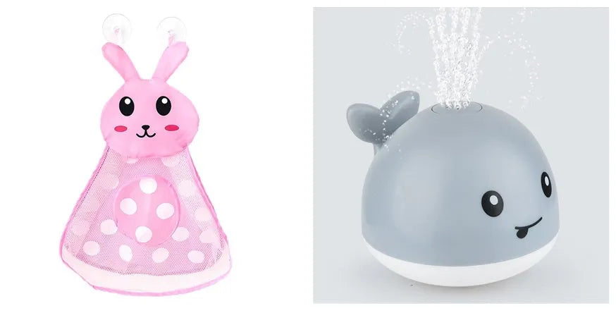 White and blue electric whale bath toy spraying water with flashing lights on a bathroom surface.