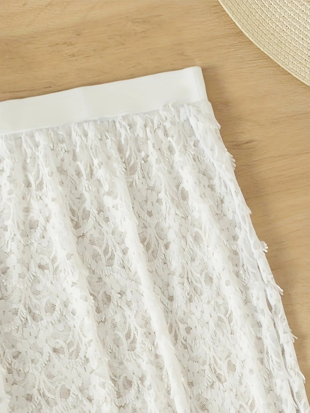 White three-piece nylon swimsuit set with a gathered long skirt, shown on a model for swimming.