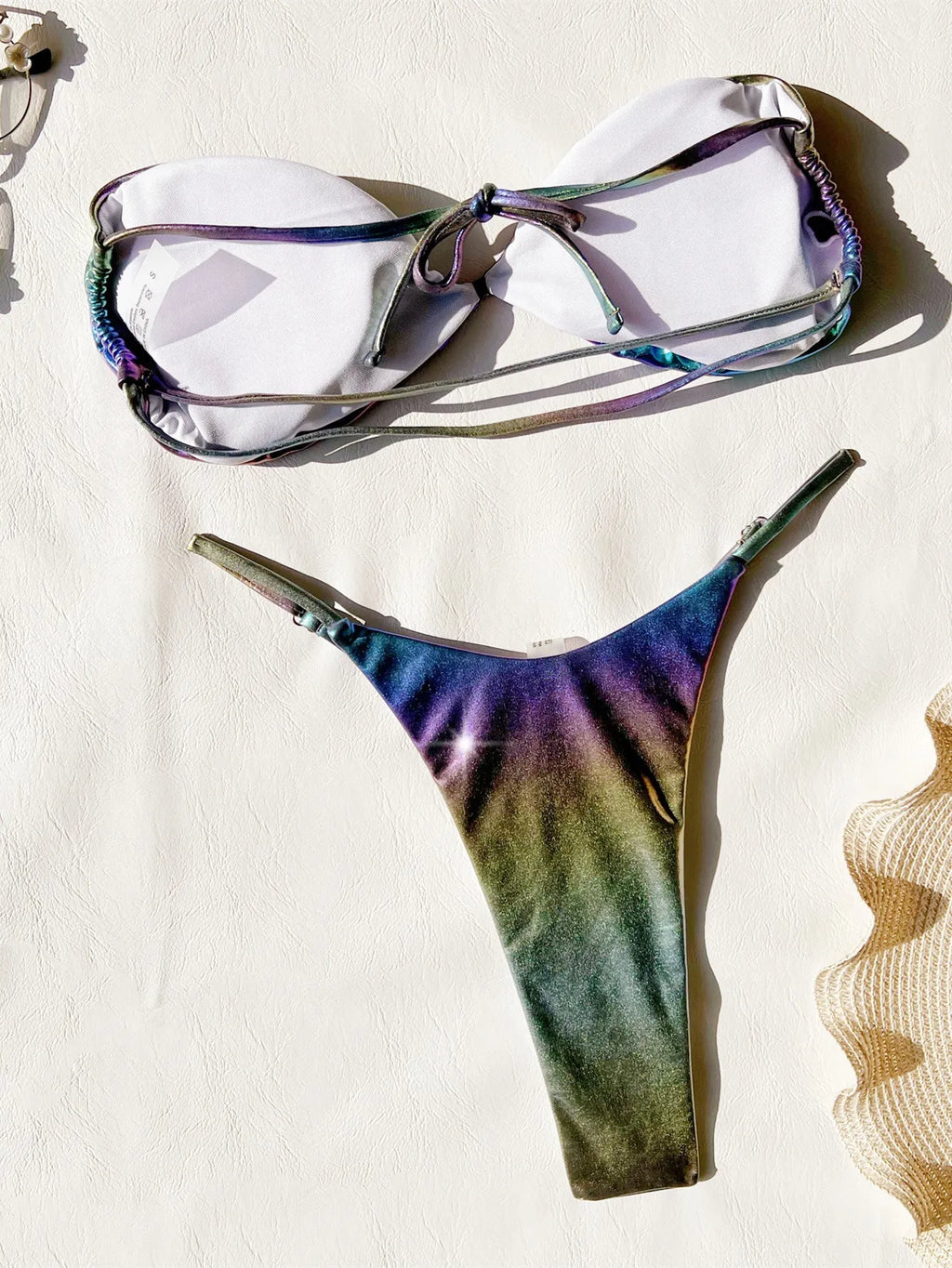 Gradient purple women's bikini swimsuit set on a mannequin.