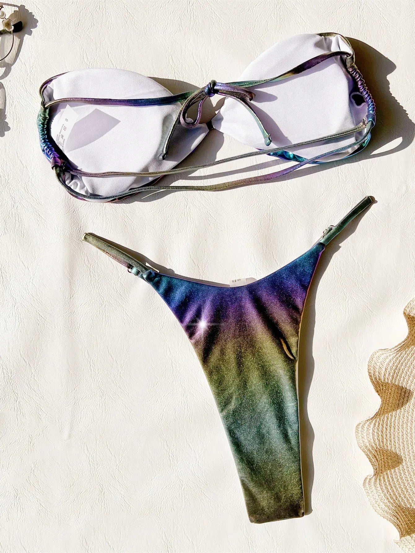 Gradient purple women's bikini swimsuit set on a mannequin.