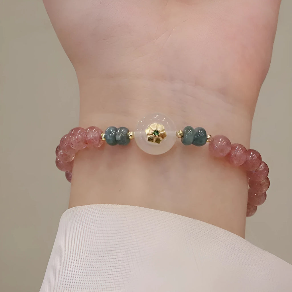 Women's strawberry quartz and blue water emerald bracelet with round jade pendant and geometric design