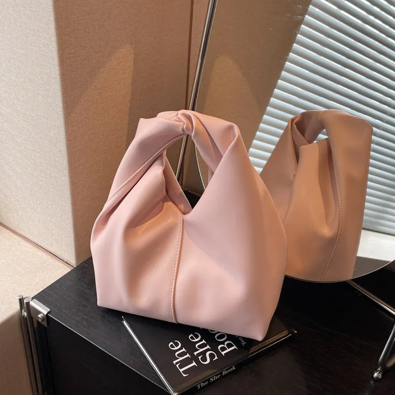 Women's casual PU leather dumpling-shaped handbag in multiple colours with internal organiser pockets.