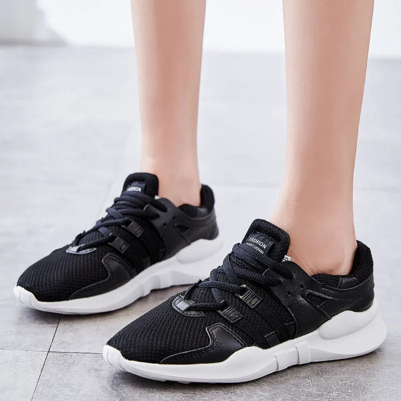 Breathable mesh casual sneakers with hollow-out design and round toe in black and white colour options