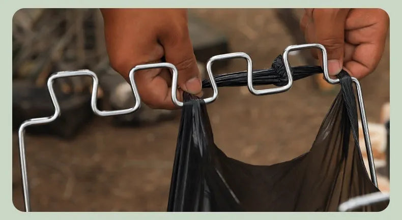 Stainless steel folding garbage bag bracket in black and silver colours for camping use