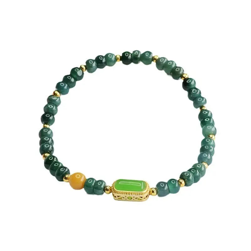 Close-up of a women's bracelet with blue water jade abacus beads in oval and round shapes on an adjustable band.