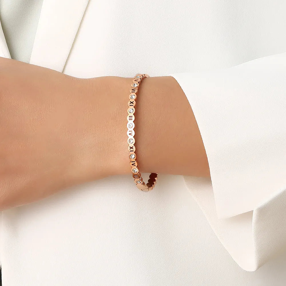 Korean style titanium steel bracelet showing gold rose gold and steel colour options with number decoration
