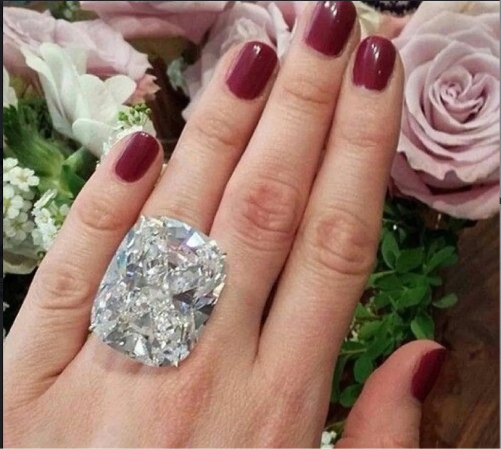 Women's white gold colour geometric ring with inlaid square diamond design on finger