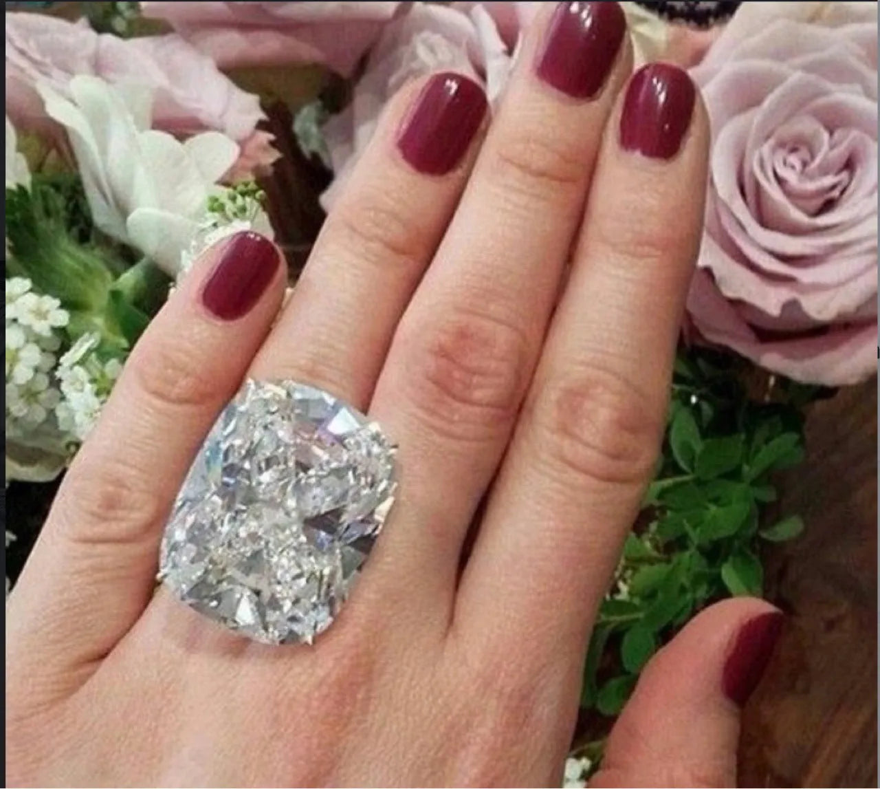 Women's white gold colour geometric ring with inlaid square diamond design on finger