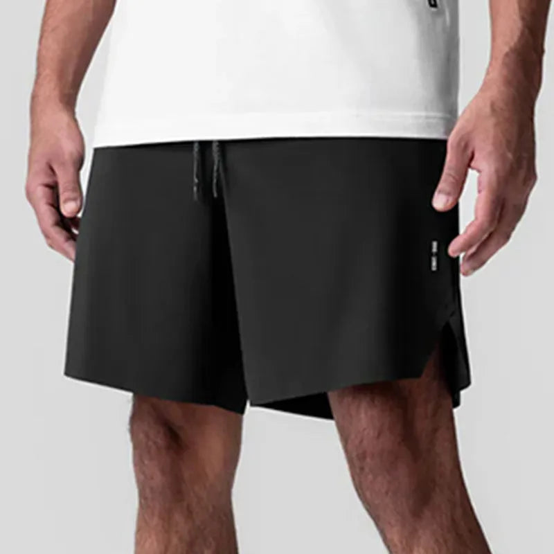 Men's grey seamless sports shorts with knee-length straight-leg cut on a plain background