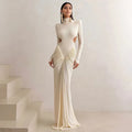 Long sleeve high collar slim fit dress with pleated backless detail in light apricot colour.