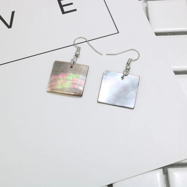 Women's shell geometric earrings with rectangular and square panther designs in natural shell material