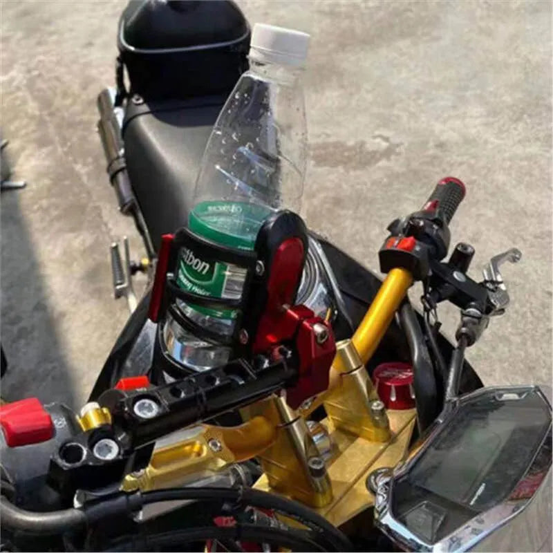 A black water bottle cage designed for mounting on a Honda X-ADV scooter bumper.
