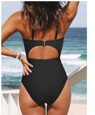 Backless one-piece swimsuit for women in solid colour on a mannequin.