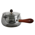Rotating glass teapot with wooden handle and stainless steel infuser basket