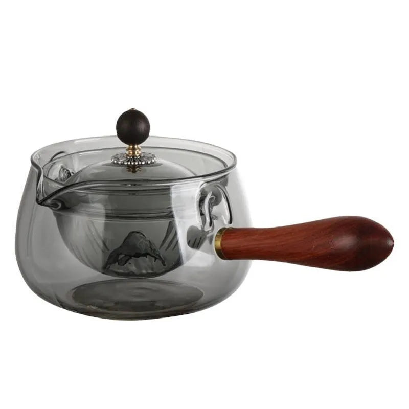 Rotating glass teapot with wooden handle and stainless steel infuser basket