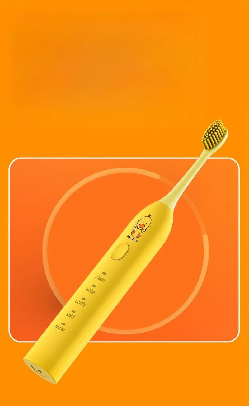 Yellow rechargeable electric toothbrush with small duck design, soft bristles, and USB charging port.