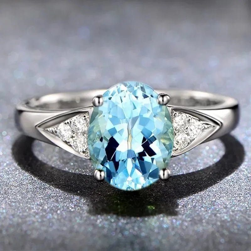 Women's court style ring set with natural blue and red zircon stone inlays in heart, water drop, and bell patterns.