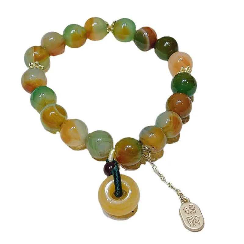 Yellow peacock agate women's bracelet with peace buckle clasp and old mine topaz accents