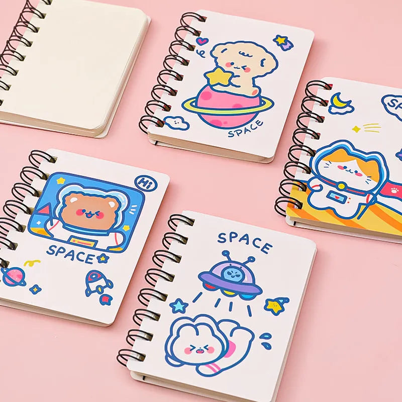 Astronaut-themed pocket flipper notebook showing compact 10.5cm by 8cm dimensions with flip-style binding