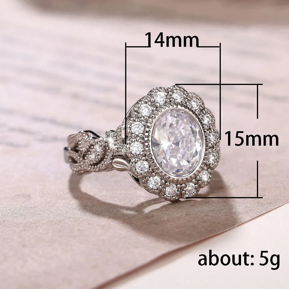 Geometric white gold plated copper ring with round zircon centrepiece on finger
