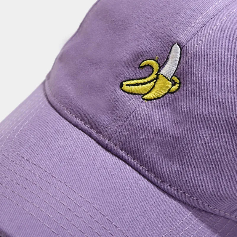 Adjustable baseball cap with cute banana embroidery in seven colour options on soft polyester fabric