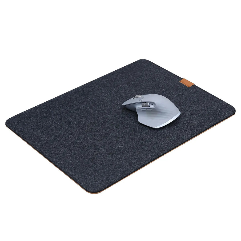 Winter warm felt cork office mouse mat with non-slip base in black and grey pattern on a desk.