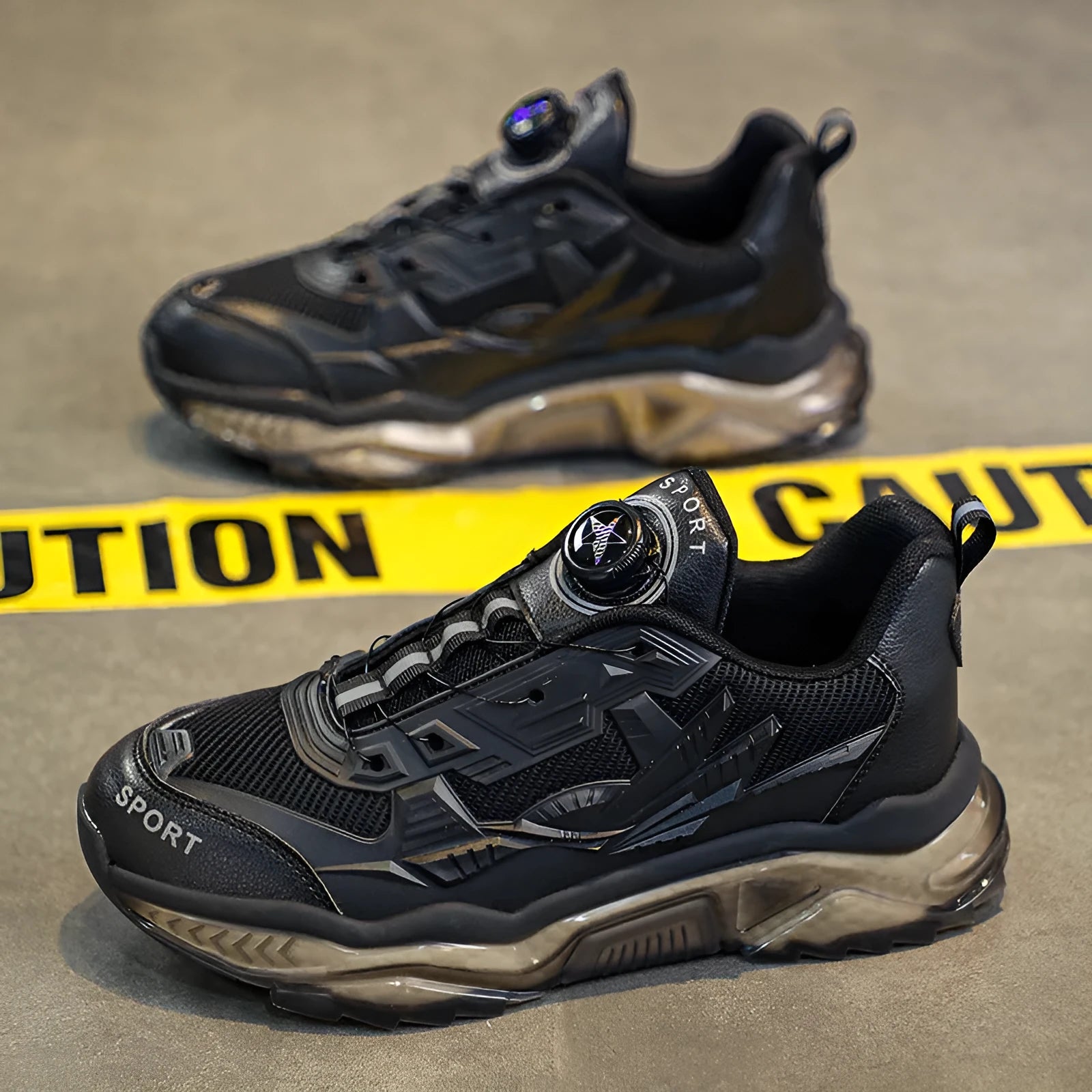 Men's black mesh casual shoe with rotating button fastener and platform sole.