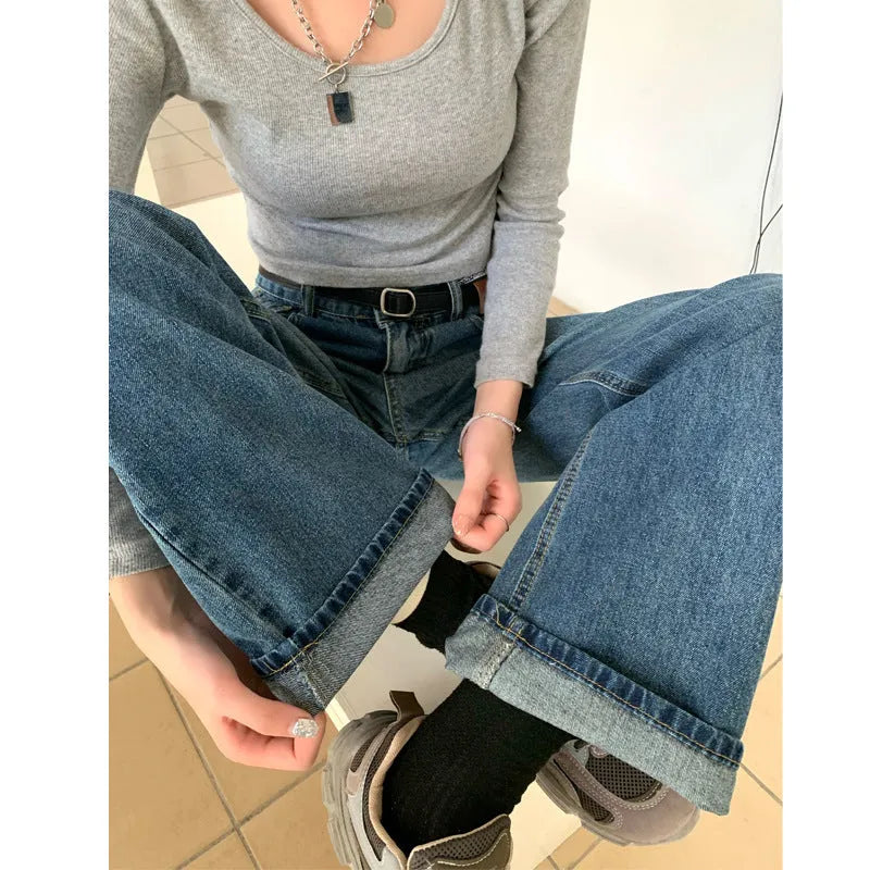 Women's high waist straight leg jeans in retro blue colour on a hanger.