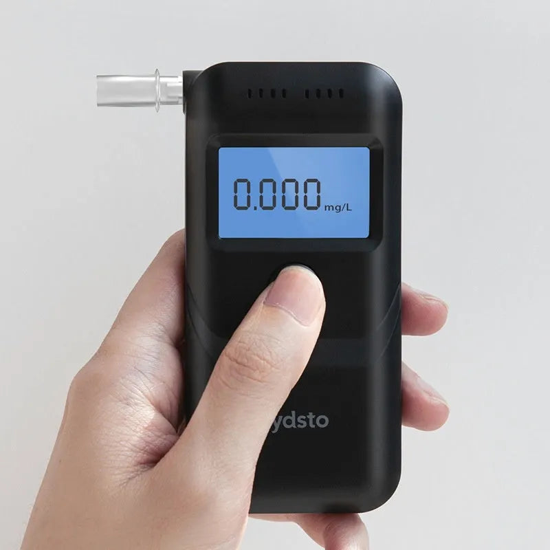 Black household alcohol tester with one-button operation for breath analysis checks