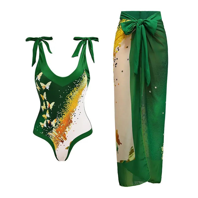 Solid colour women's one-piece swimsuit with thin spaghetti straps and a removable wrap skirt.